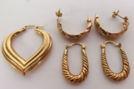 A PAIR OF 9ct GOLD HALF-HOOP EARRINGS, spirally fluted; ANOTHER PAIR HORSESHOE SHAPED AND A 9ct GOLD