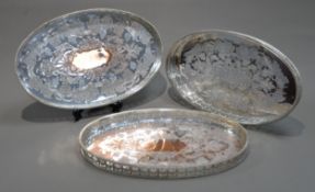 PAIR OF VINERS SILVER PLATED ON COPPER OVAL GALLERIED TRAYS, each with chased fruiting vine centre