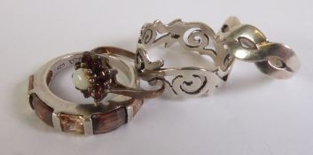 TWO SILVER GEM-SET RINGS and TWO PLAIN SILVER BAND RINGS, with pierced decoration (4)