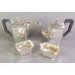EARLY TWENTIETH CENTURY ART DECO ENGRAVED SILVER FOUR PIECE TEASET, of caned oblong form with