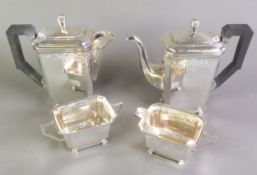 EARLY TWENTIETH CENTURY ART DECO ENGRAVED SILVER FOUR PIECE TEASET, of caned oblong form with