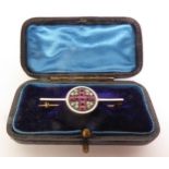 EARLY 20TH CENUTRY RUBY, DIAMOND AND WHITE ENAMEL ST GEORGE’S FLAG BROOCH, calibré-cut rubies and
