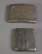 TWO GEORGE V ENGINE TURNED SILVER POCKET CIGARETTE CASES, each of curved oblong form with