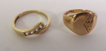 9CT GOLD SIGNET RING, London 1969, ring size J1/2; and a 9CT GOLD CUBIC ZICONIA CROSSOVER RING,