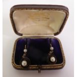 PAIR OF EARLY 20TH CENTURY BLACK ENAMEL, PEARL AND DIAMOND PENDANT EARRINGS, button pearls suspended