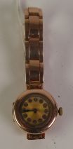 LADY’S 9CT GOLD CASED BRACELET WATCH, mechanical movement, circular gilt dial with silvered Arabic