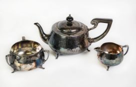 GEORGE V ART DECO PLANISHED SILVER THREE PIECE TEASET BY THE BARKER BROTHERS, of circular bellied