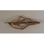 1960s BI-COLOUR GOLD TEXTURED ABSTRACT LEAF BROOCH, marked ‘WT’, ‘750’ and ‘14K’, 5.5cm by 2.3cm,