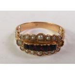 19TH CENTURY FRENCH 18CT GOLD GARNET AND SEED PEARL RING, five graduated cushion-cut garnets