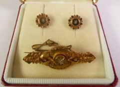 15CT GOLD ETRUSCAN REVIVAL DIAMOND BROOCH, a rose-cut diamond in a star setting, to a wing frame
