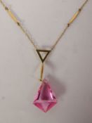 PINK PASTE PENDANT NECKLACE, a kite-shaped pink paste drop suspended from a fancy surmount, to a