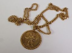 9CT GOLD ST CHRISTOPHER PENDANT ON A 9CT GOLD CUBAN LINK CHAIN, Birmingham 1976 and London 1977,