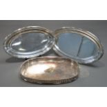 SILVER PLATED ON COPPER TWO HANDLED GALLERIED TRAY, of rounded oblong form with cut-out handles,