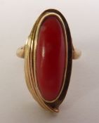 RED CORAL DRESS RING, an oval coral in a fancy fluted frame, ring size J, 4.8g