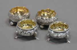 PAIR OF VICTORIAN SILVER CAULDRON-SHAPE SALT-CELLARS with beaded rims, chased with flowers