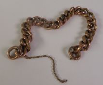 A FANCY CURB LINK BRACELET, of foliate engraved and plain links, marked ‘9CT’, 19.5cm long, 15.3g (