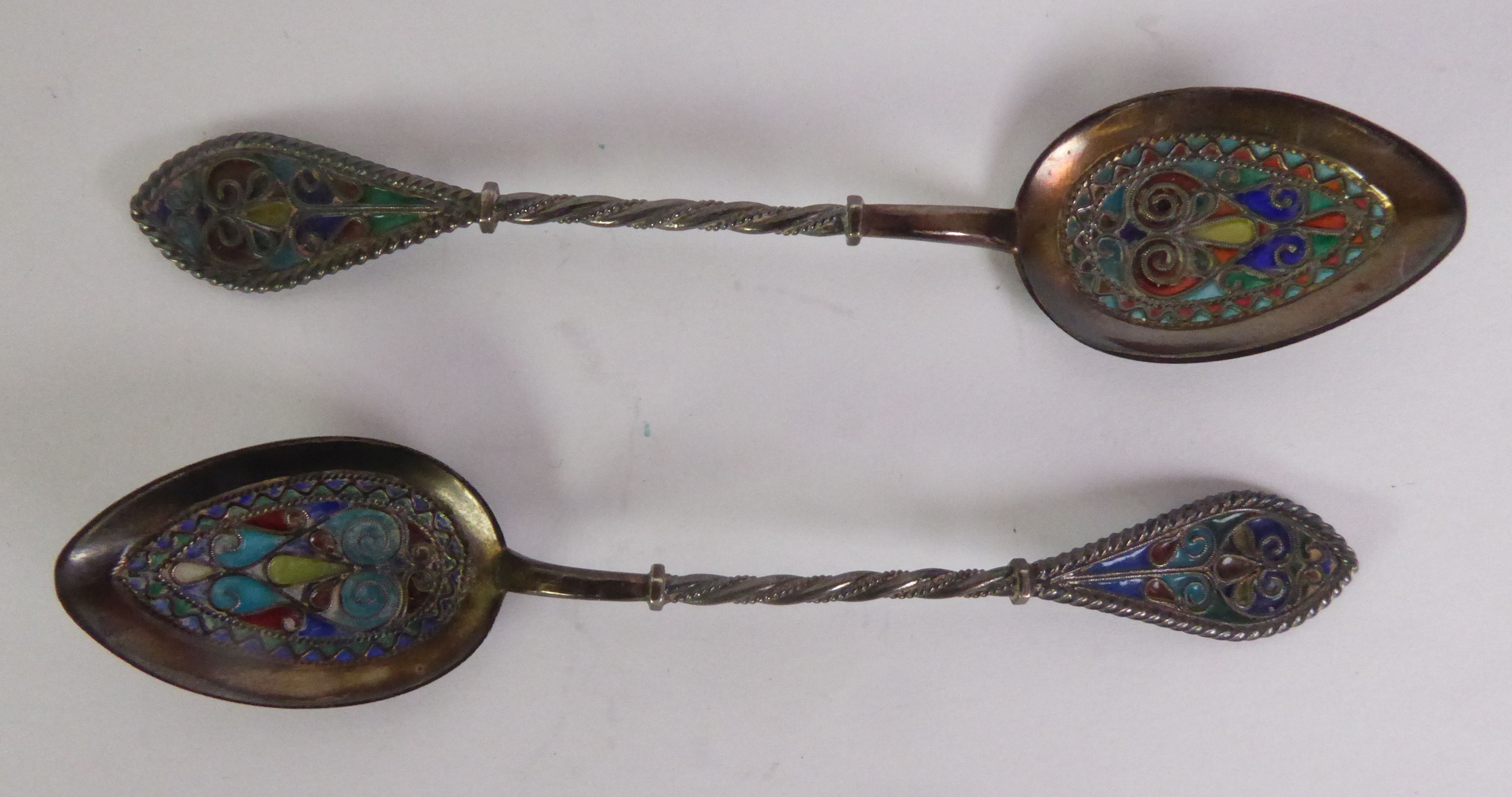 PAIR OF FOREIGN SILVER COLOURED FILIGREE METAL (800 STANDARD) AND ENAMELLED COFFEE SPOONS, 4” (10.