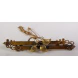 EDWARDIAN 15CT GOLD SEED PEARL BAR BROOCH, a textured spray of leaves set with seed pearls to a