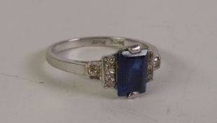 ART DECO SAPPHIRE AND DIAMOND RING, a baguette-cut sapphire to stepped milgrain set diamond