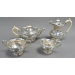 GEORGE V FOUR PIECE SILVER PEDESTAL TEASET WITH IVORY HANDLES BY WALKER & HALL, of lobated form with