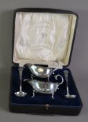 GEORGE VI CASED PAIR OF SILVER SAUCE BOAT AND TREFID LADLES BY WILLIAM HUTTON & Co Ltd, retailed