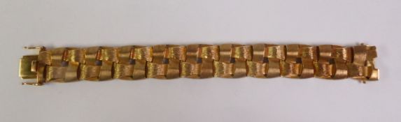 CIRCA 1970S 9CT GOLD BRACELET, of woven textured and brush polished links, import London 1974, 2cm
