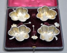 CASED SET OF FOUR LATE VICTORIAN SILVER CLOVER-LEAF SHAPE SALT-CELLARS with MATCHING SPOONS (one