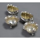 PAIR OF EARLY TWENTIETH CENTURY SILVER OVAL DEMI-GADROONED SALT-CELLARS, with gilded interiors,