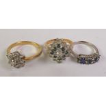 SILVER BLUE AND WHITE PASTE RING and TWO GILT METAL AND PASTE SET CLUSTER RINGS (3)