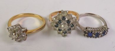 SILVER BLUE AND WHITE PASTE RING and TWO GILT METAL AND PASTE SET CLUSTER RINGS (3)