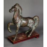 ORIENTAL ANTIQUE STYLE PATINATED BRONZE MODEL OF A HORSE, modelled with front right leg raised,