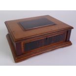 EARLY TWENTIETH CENTURY OAK, EBONY AND MAHOGANY TABLE CIGAR BOX. With raised panels to the top and