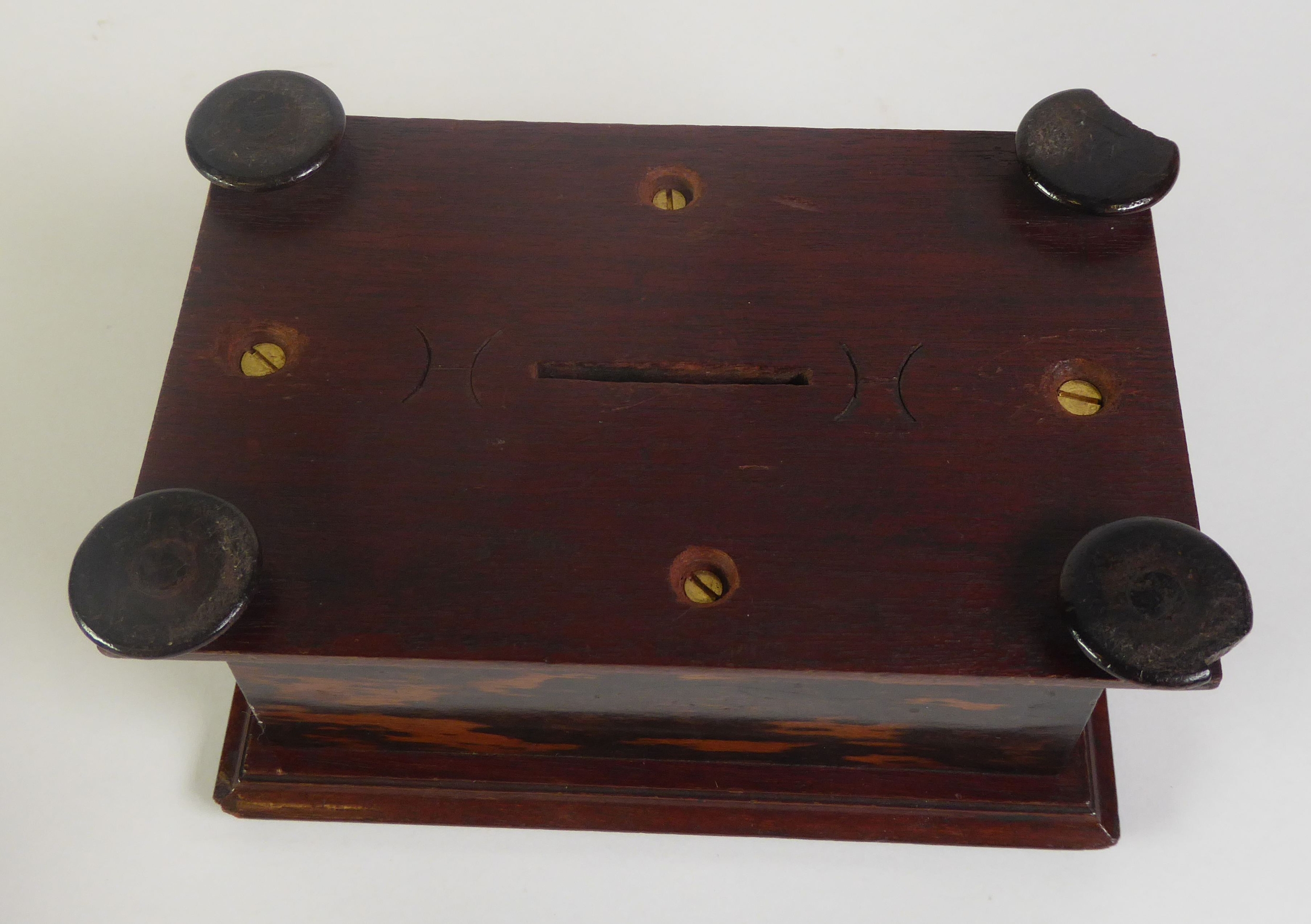 EARLY TWENTIETH CENTURY EBONY MONEY BOX, of moulded oblong form with bun type feet and slot to the - Image 2 of 2
