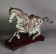 ORIENTAL ANTIQUE STYLE PATINATED BRONZE MODEL OF A CEREMONIAL HORSE, modelled in trotting pose,
