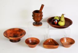 OLIVE WOOD PEDESTAL PESTLE AND MORTAR, together with FOUR TURNED WOOD BOWLS, one stamped for