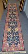 EASTERN TRIBAL HEAVY FLAT WEAVE RUNNER with large repeat medallion pattern on a dark blue field,