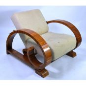 ART DECO LOUNGE ARMCHAIR, with reclining back, veneered broad flat arms and sledge feet,