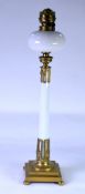 LATE VICTORIAN/EDWARDIAN TALL OIL LAMP, the stepped brass base supporting a column in OPAQUE WHITE