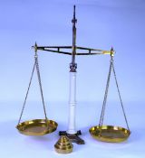 EDWARDIAN W & T AVERY CAST IRON and POLISHED BRASS BALANCE with two chain-suspended BRASS SCALES,