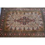 QUM, PERSIAN SILK RUG with black and floral centre medallion wiht pendant, on a cream and all-over