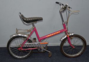 RALEIGH COMMANDO: 1970s pushbike in puce paintwork with fluorescent orange, yellow and black decals,