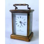 MATTHEW NORMAN, SWITZERLAND, 20th Century brass and bevelled plate glass CARRIAGE CLOCK, with