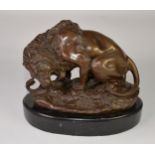 POST-WAR BRONZE REPLICA MODEL OF A LION and a SNAKE, on an OVAL BLACK MARBLE BASE, 9 ½" (24cm) high,