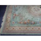 LARGE EMBOSSED WASHED CHINESE CARPET, heavy quality of Aubusson style with a floral circular