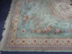 LARGE EMBOSSED WASHED CHINESE CARPET, heavy quality of Aubusson style with a floral circular