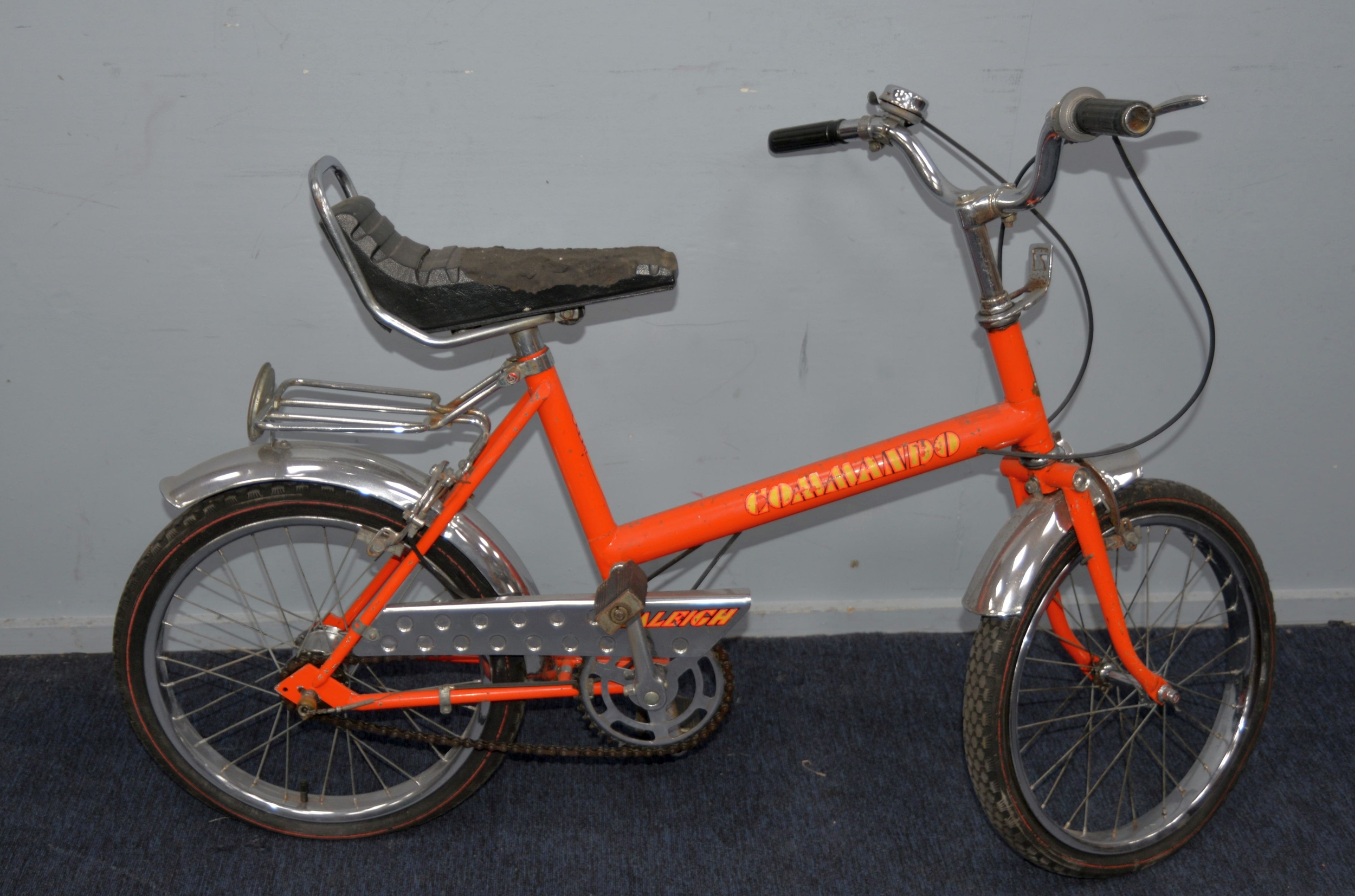 RALEIGH COMMANDO: 1970s pushbike in orange paintwork with fluorescent orange, yellow and black