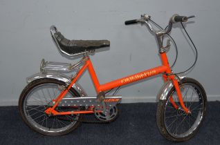 RALEIGH COMMANDO: 1970s pushbike in orange paintwork with fluorescent orange, yellow and black