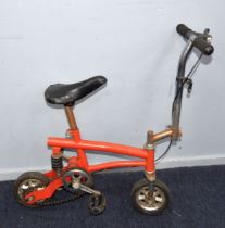 MONKEY BIKE: An unbranded miniature push bike or monkey bike, in orange/red paintwork, 2ft (61 cm) L