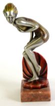SILVER AND GILT PATINATED METAL ART DECO FEMALE FIGURE wearing a swimming costume, in crouching