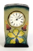 MOORCROFT: Rosehip pattern Moorcroft Pottery quartz mantel clock, fully marked and dated 93 to the